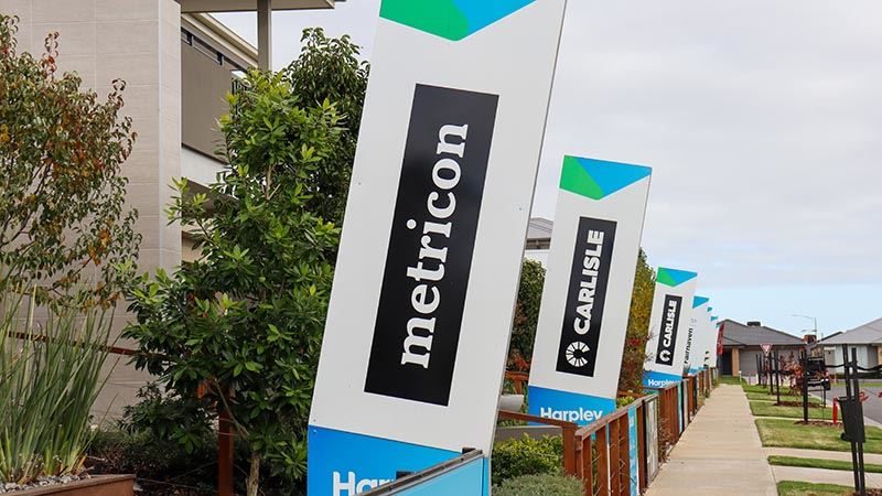 New homes builders display village with Metricon signage in the foreground