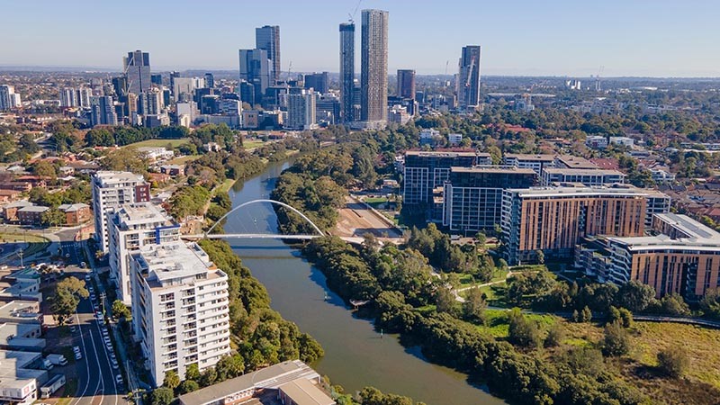 Aerial drone view of Parramatta CBD above Parramatta River in Greater Western Sydney, NSW, Australia showing development of the city.