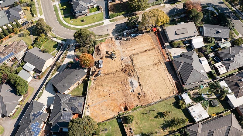 Aerial photo of vacant residential land under development in a suburb in Australia.